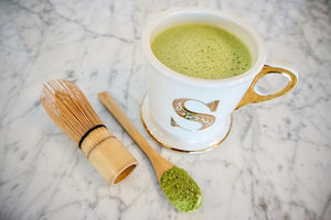 TAP IN wellness journal and matcha tea latte.