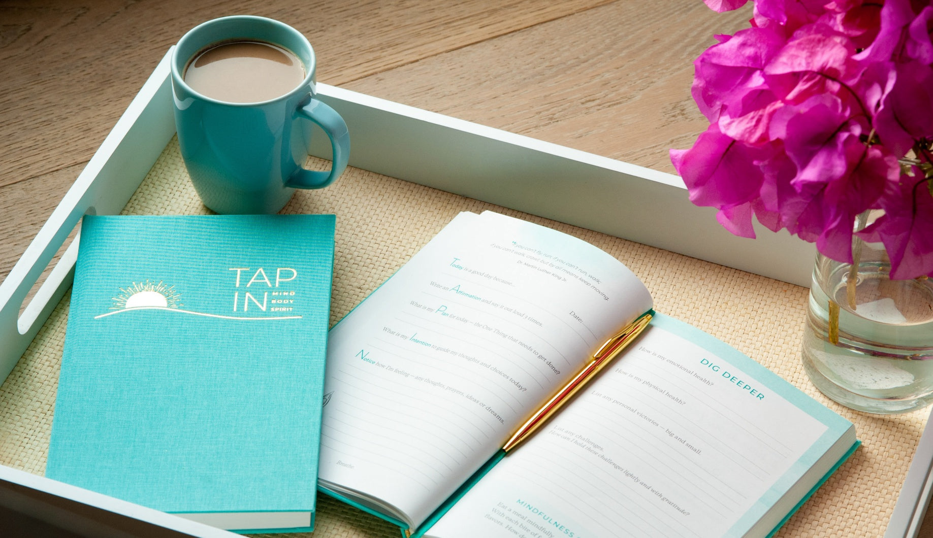 TAP IN wellness journal seafoam blue linen cover and open pages with teal illustrations.