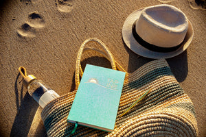TAP IN wellness journal on the beach.
